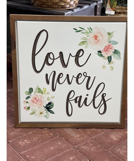 Love Never Fails Wood Sign